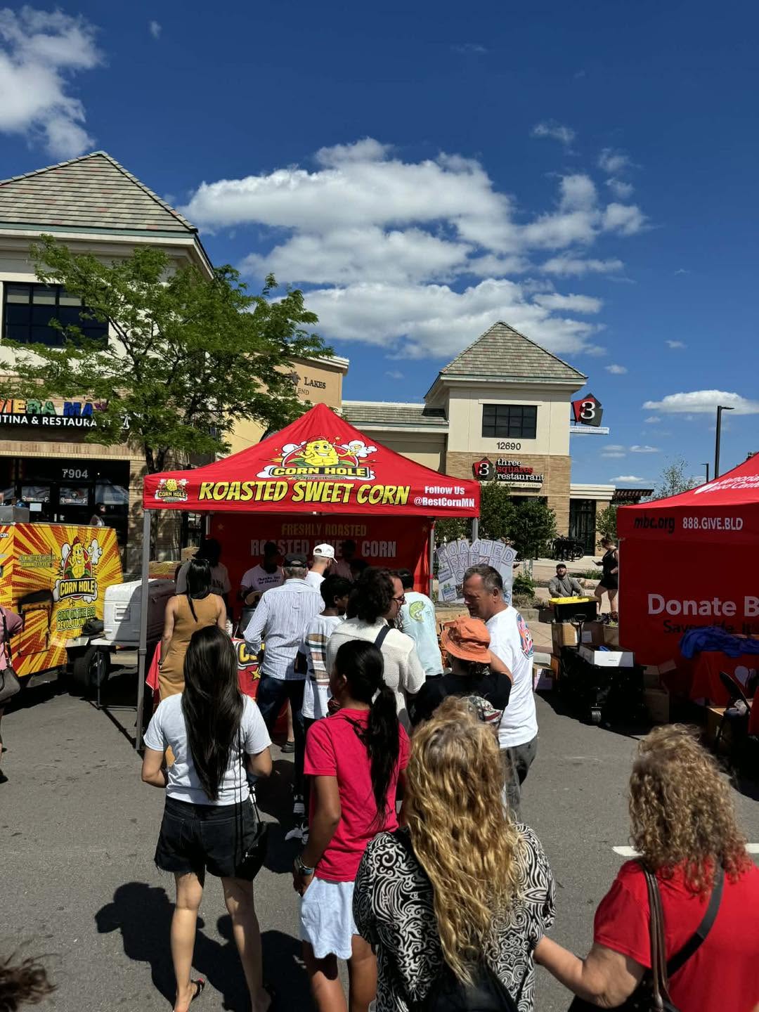Crowd gathered at the Big Red Tent for BestCornMN roasted sweet corn